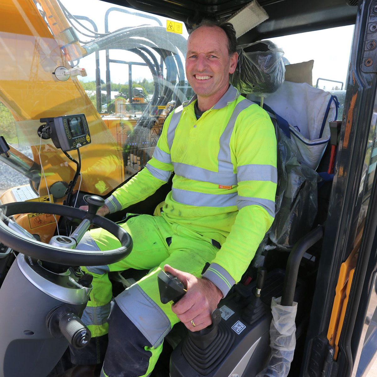 Richie Collins from Collins Plant in the cab of his new HW140