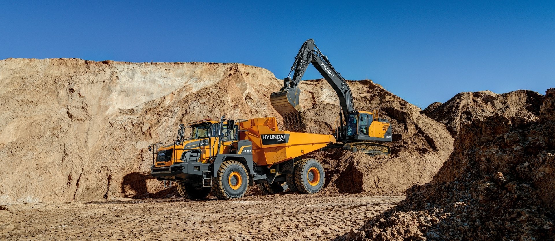 HA45A 4x4 Articulated Dump Truck being loaded by Hyundai Excavator