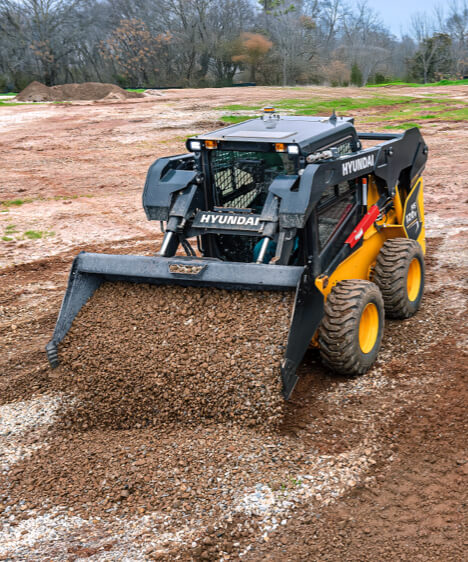 Hyundai HS120V Skid Steer Loader working on construction site