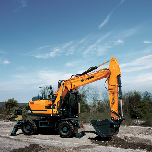 hw160-hyundai-wheeled-excavator-in-the-field-roadwork